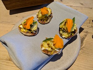 20240809_PXL172556677_Pixel7a-JEB amuse bouche: sourdough bread, barbecued baby sweetcorn, egg yolk, nasturtium