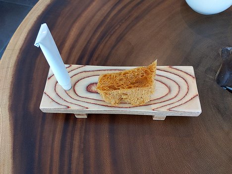20221030_PXL112452042.MP_Pixel3a-JEB amuse bouche: miso bread with tube of tuna fish paste