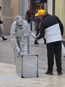 Living statue going home, Malaga, Spain : Living statue going home, Malaga, Spain